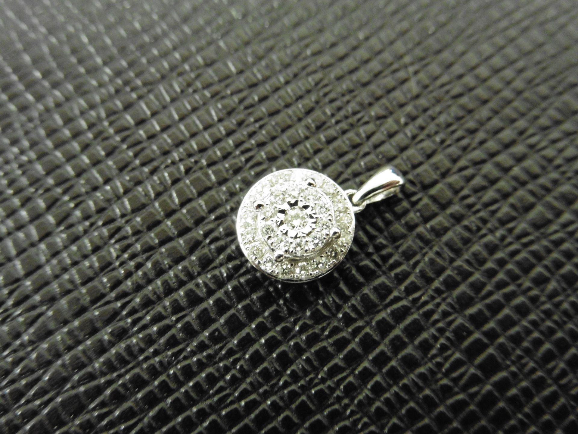 0.24ct illusion set diamond pendant in 9ct white gold. Small round cut diamonds, H colour and I1 - Image 2 of 3