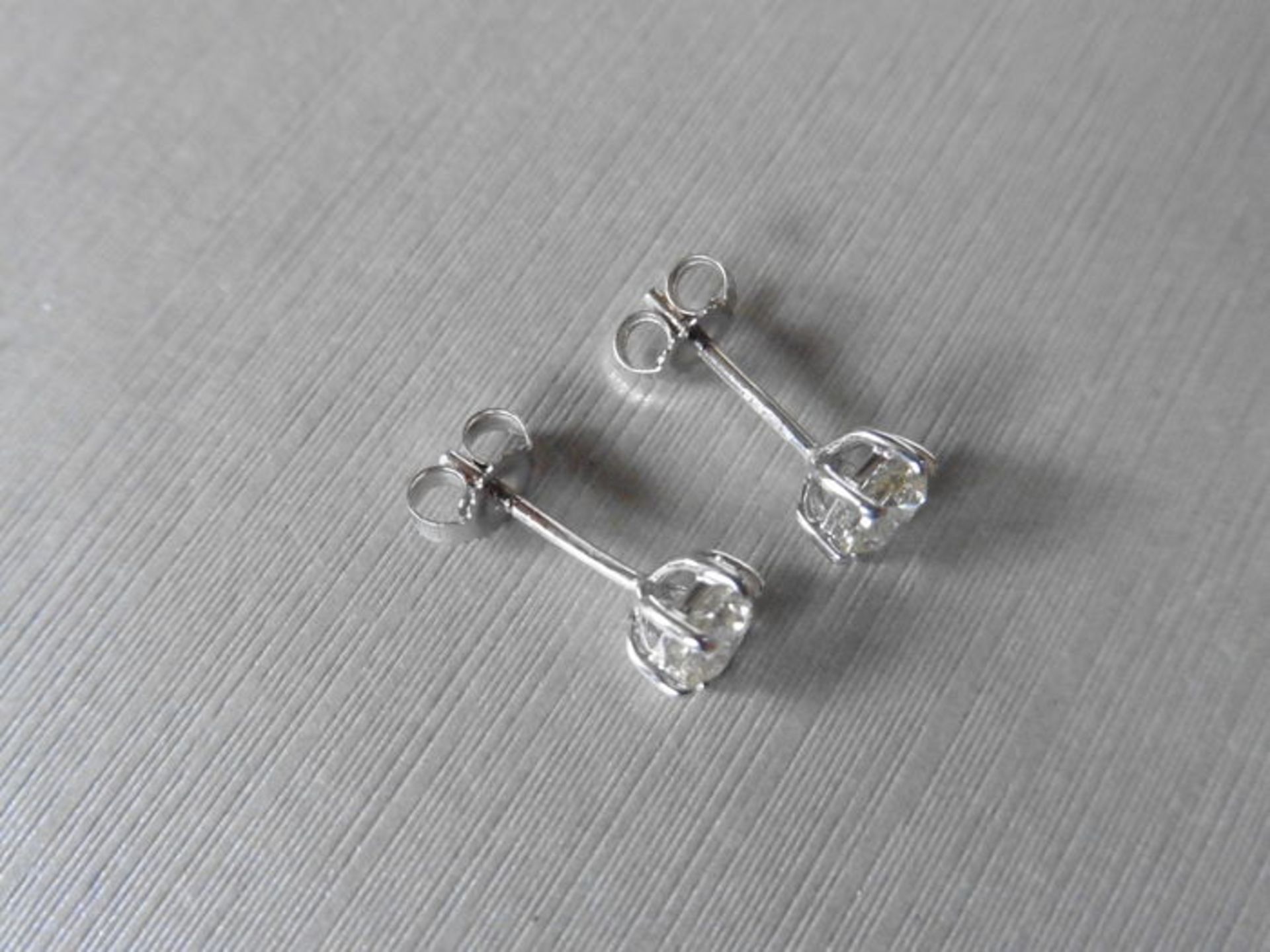 1.00ct Solitaire diamond stud earrings set with brilliant cut diamonds, SI3 clarity and H colour. - Image 2 of 2