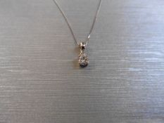 0.10ct diamond solitaire pendant set in 18ct gold. 4 claw setting, plain bale. I colour and si3