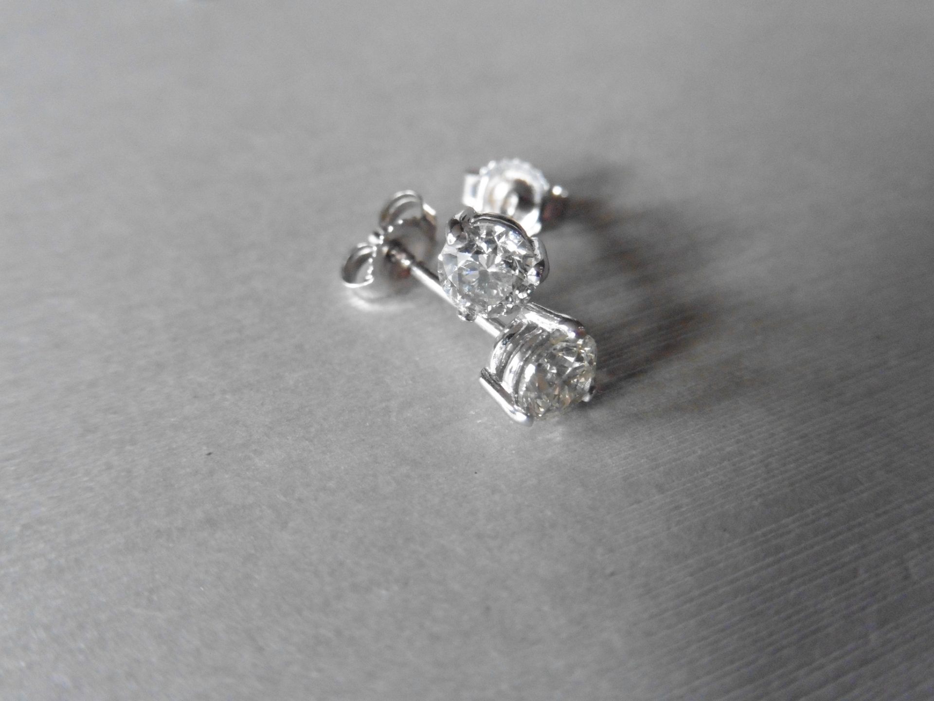 0.80ct Diamond solitaire earrings set with brilliant cut diamonds, I colour SI2 clarity. Six claw