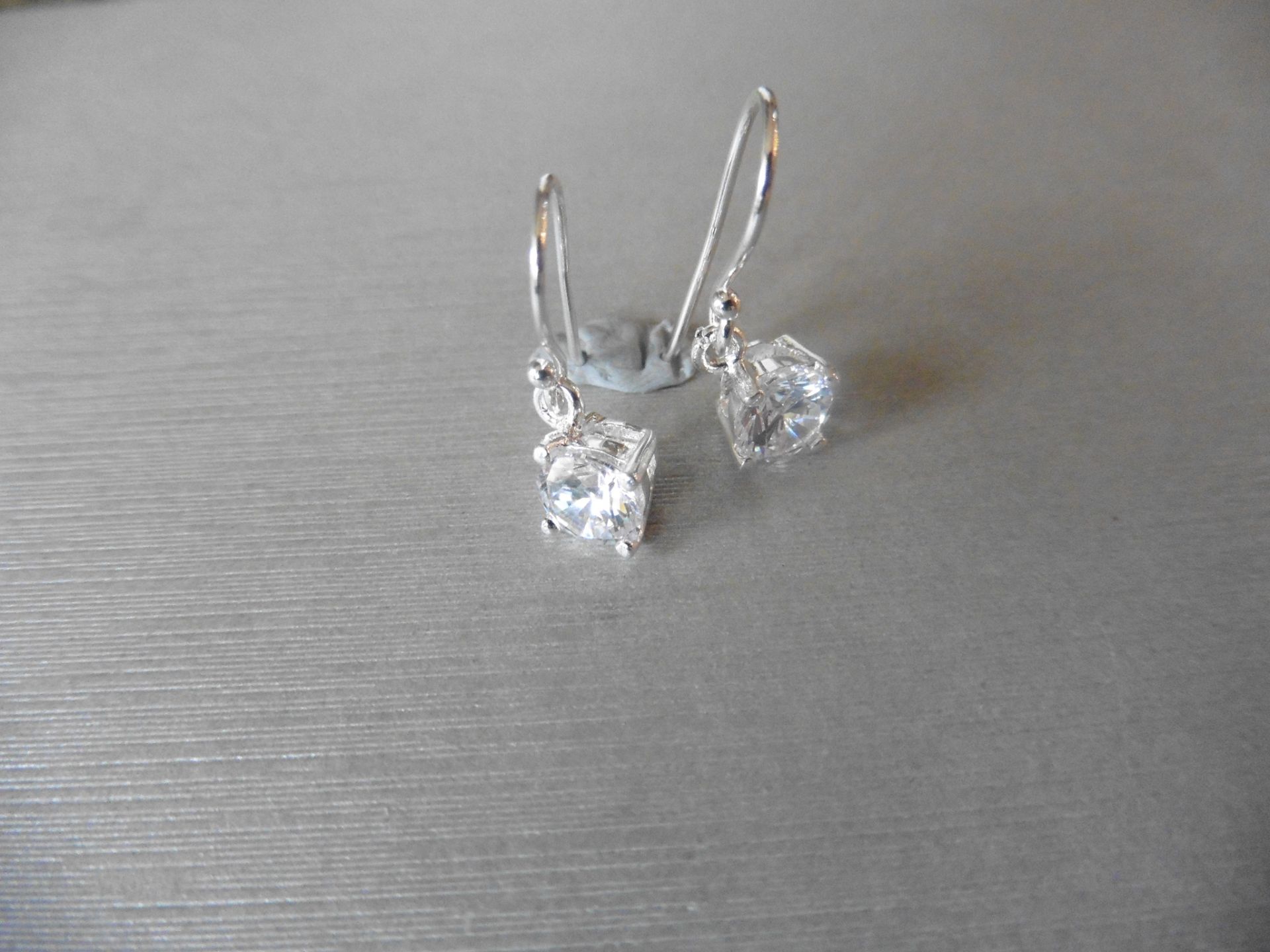 0.80ct diamond drop style solitaire earrings each set with a brilliant cut diamond, I colour, Si2