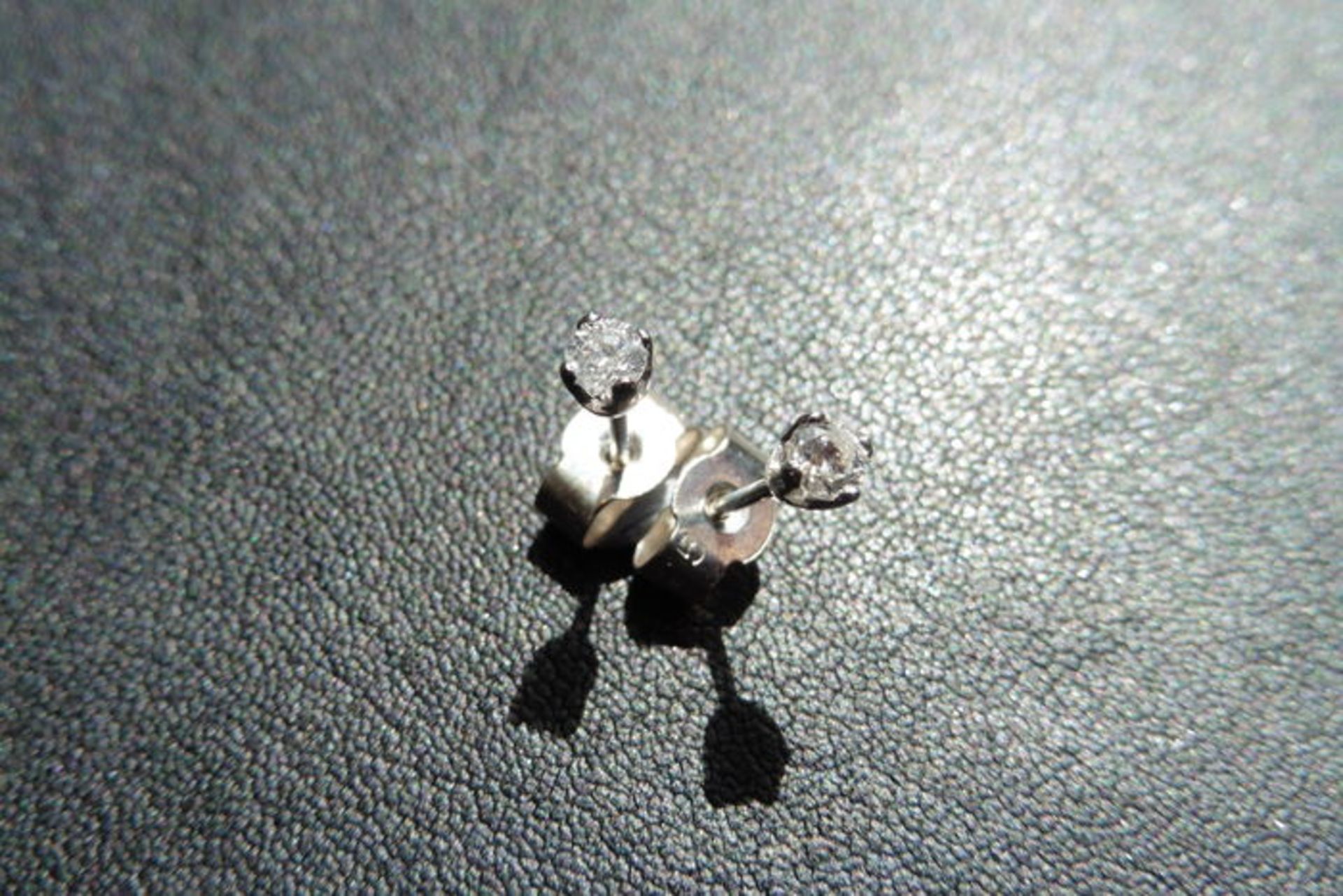 0.10ct Solitaire diamond stud earrings set with brilliant cut diamonds, SI2 clarity and I colour.