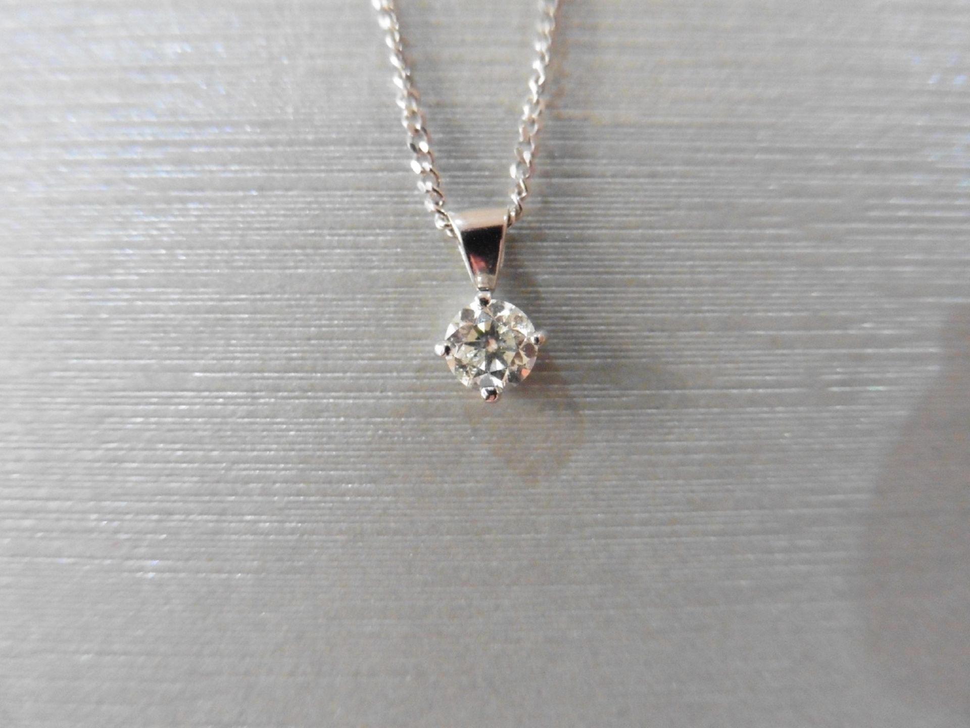 0.50ct diamond solitaire pendant set in 18ct gold. 4 claw setting, plain bale. Enhanced brilliant