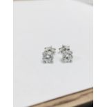 1.00ct diamond solitaire earrings set in platinum. 2 x brilliant cut diamonds, 0.50ct ( enhanced ) i