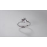 1.02 ct diamond twist solitaire ring set in platinum. 6 claw setting. Enhanced brilliant cut