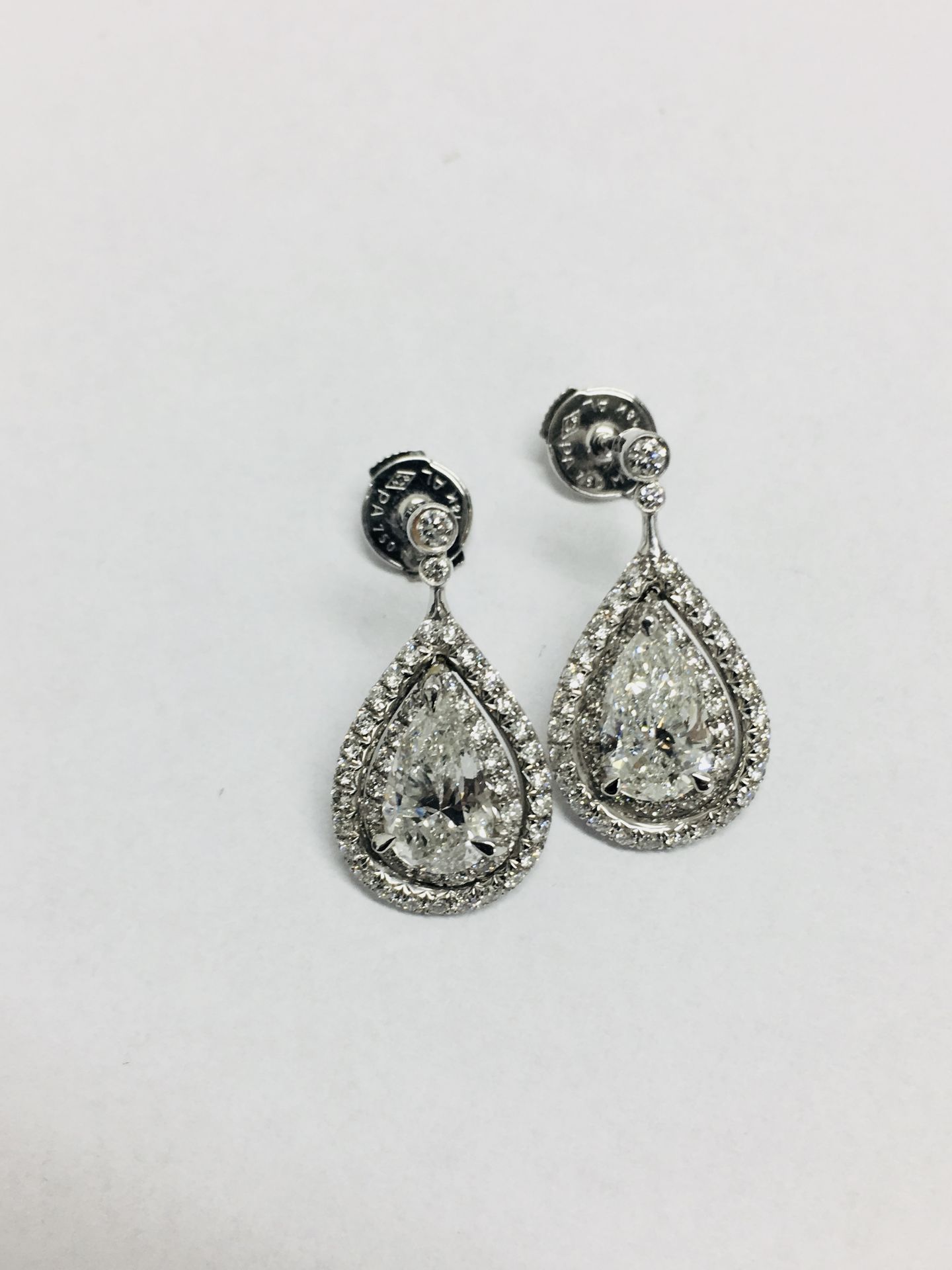 2.04ct diamond drop earrings. Each set with a certificated pear shaped diamond with a halo - Image 4 of 6