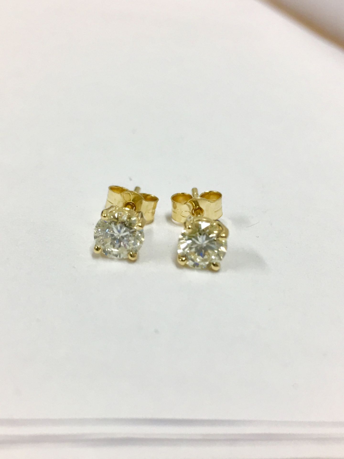 1ct diamond solitaire earrings,2 x 0.50ct h colour vs grade (enhanced diamonds) 2gms 18ct yellow .uk