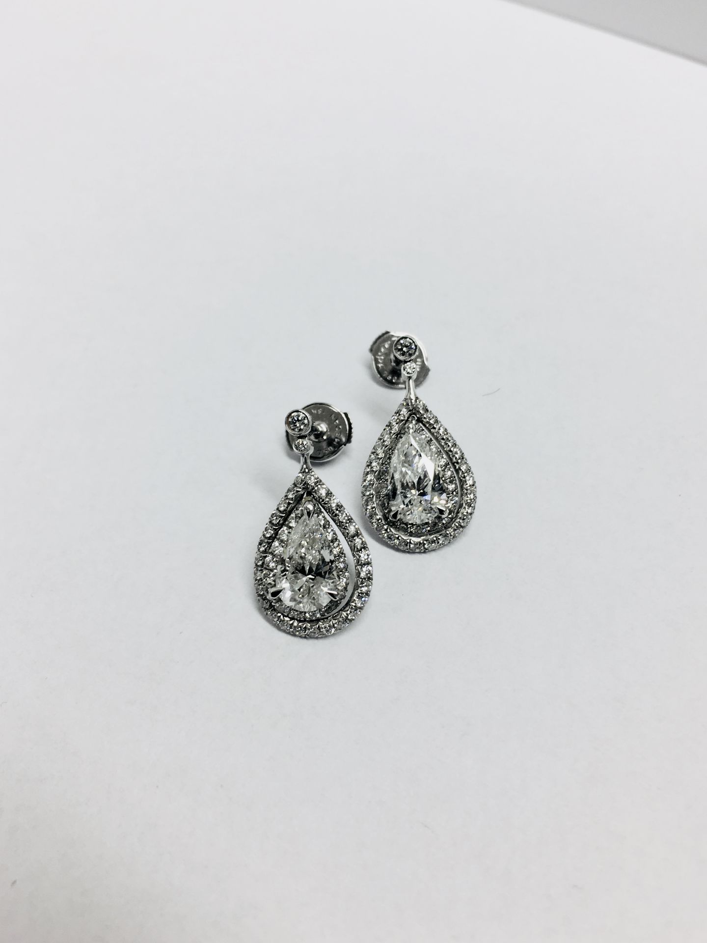 2.04ct diamond drop earrings. Each set with a certificated pear shaped diamond with a halo - Image 6 of 6