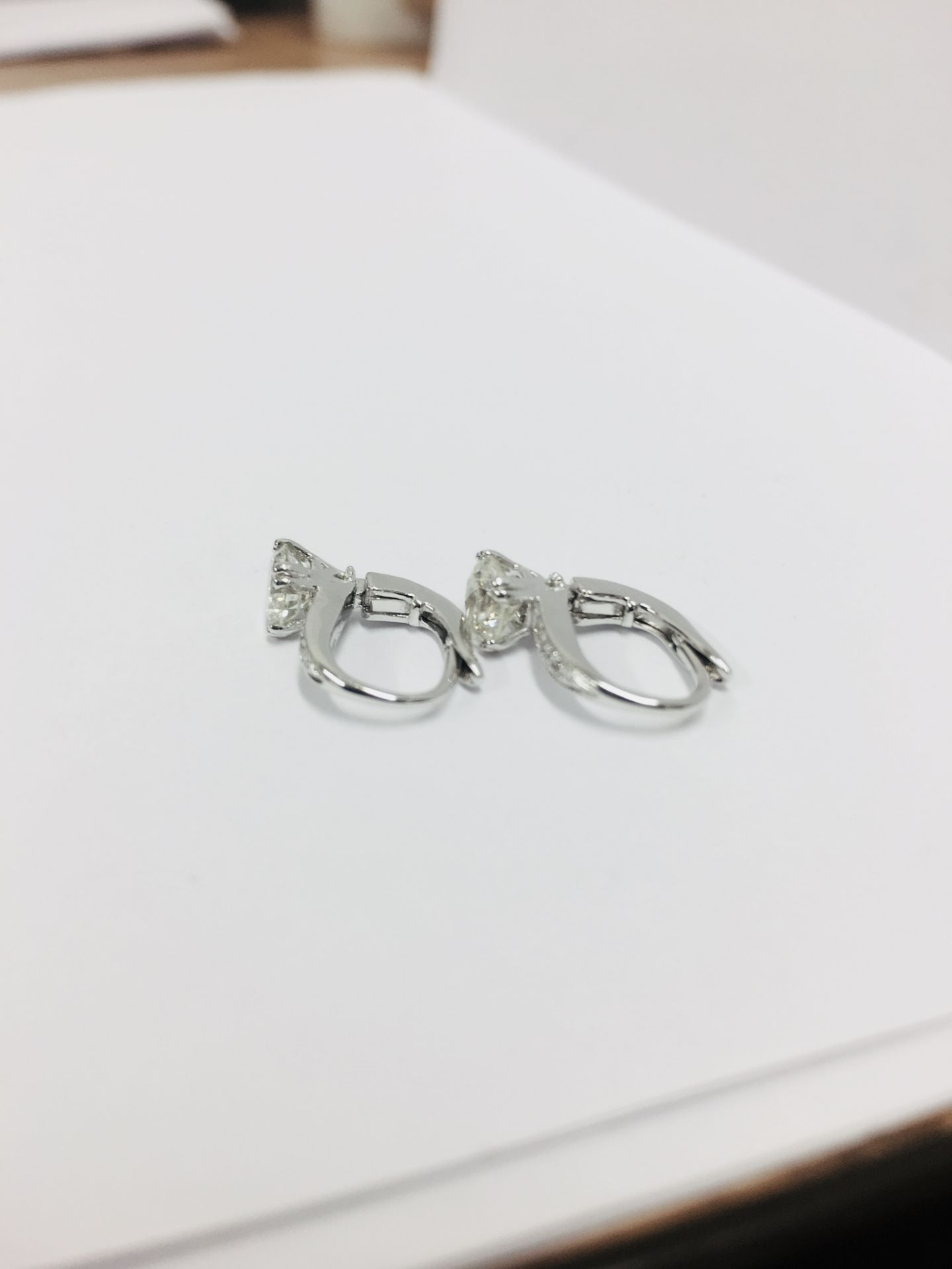 18ct white gold hoop style earrings with hinge fastners. Brilliant cut diamonds, I colour and I1 - Image 2 of 4