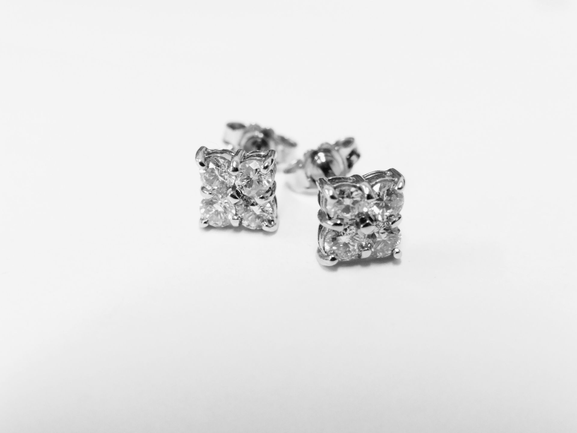 18ct diamond earrings,0.80ct in 8 stone 0.10ct each i si2 clarity and colour 2gms 18ct white gold uk