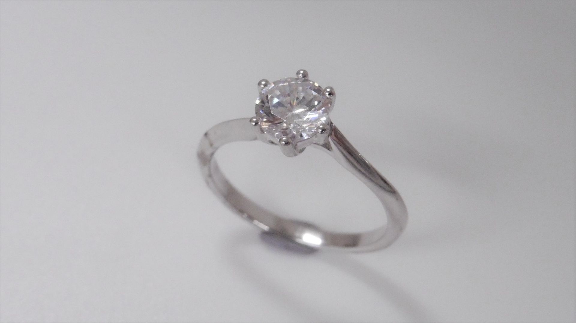 1.02 ct diamond twist solitaire ring set in platinum. 6 claw setting. Enhanced brilliant cut - Image 2 of 2