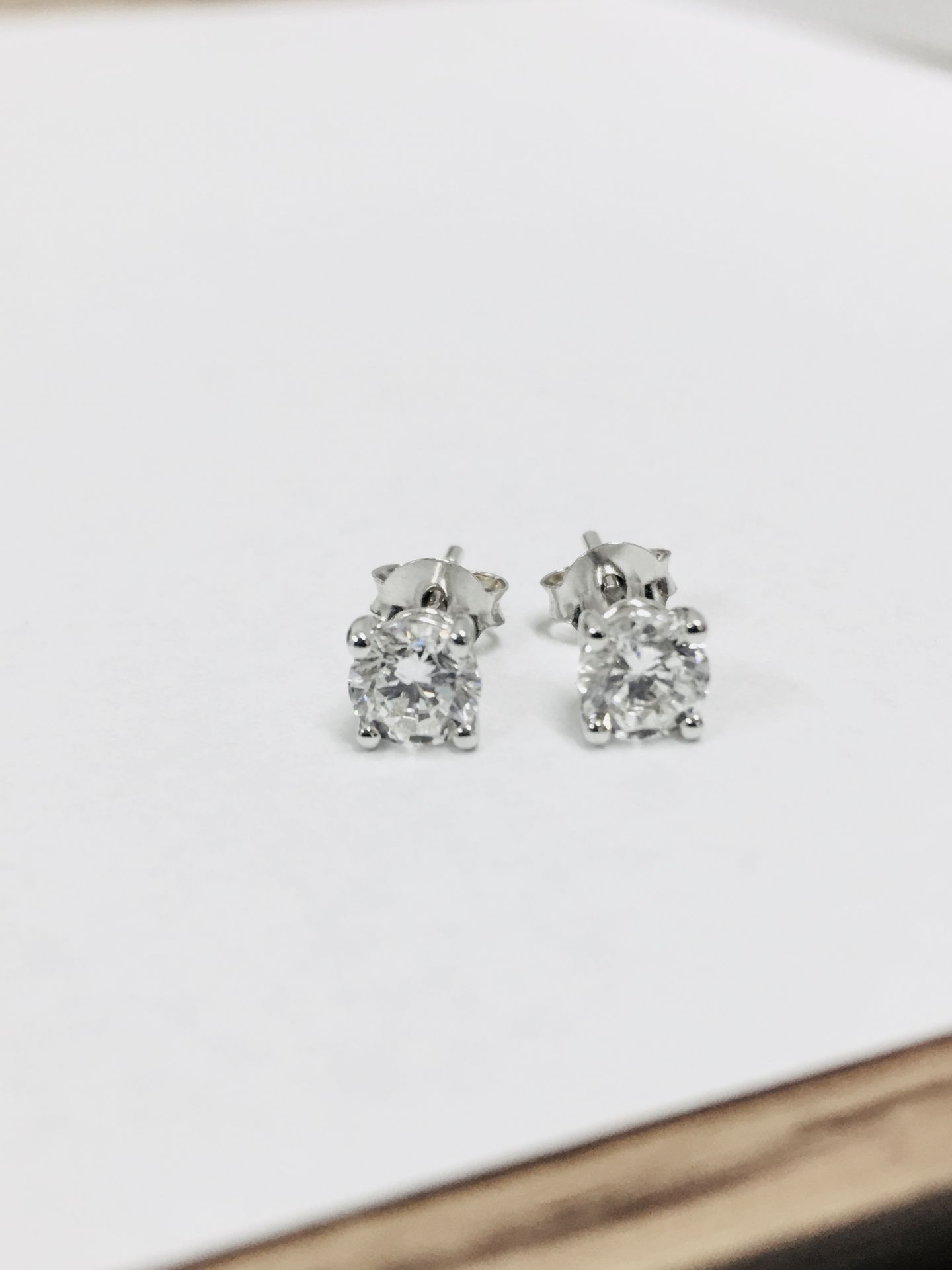 1.00ct diamond solitaire earrings set in platinum. 2 x brilliant cut diamonds, 0.50ct ( enhanced ) i