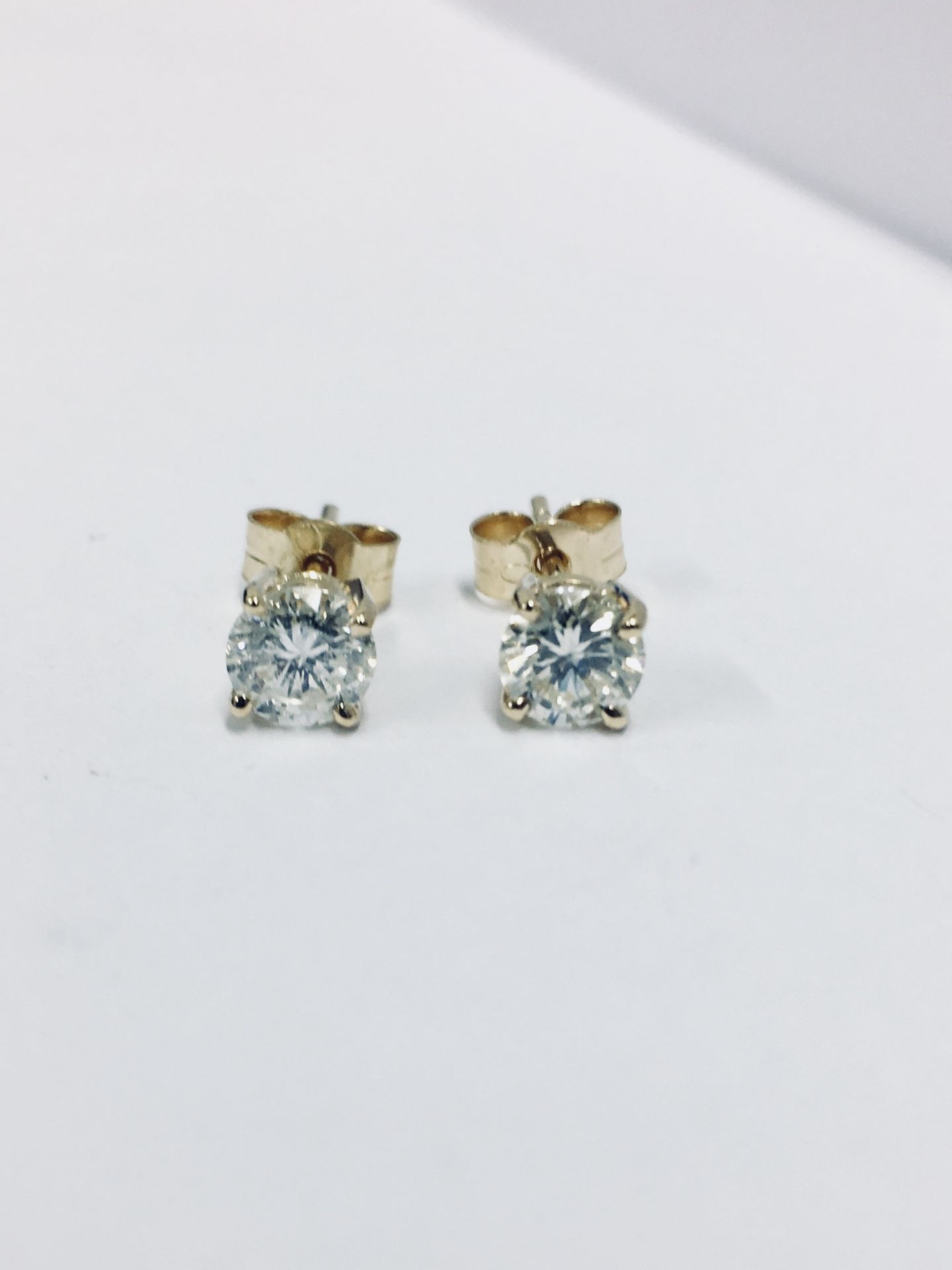 1.00ct diamond solitaire earrings set in 18ct yellow gold. 2 x brilliant cut diamonds, 0.50ct (