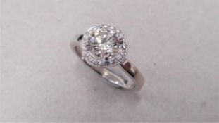 1.04ct diamond set soliatire ring in platinum. H colour and I1 clarity. Halo setting small