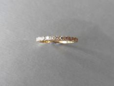 0.32ct diamond band ring set in 18ct yellow gold. Small brilliant cut diamonds, I colour and i1