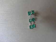 Emerald and diamond drop style earrings set in 18ct gold. Each set with 4 emerald cut ( treated)
