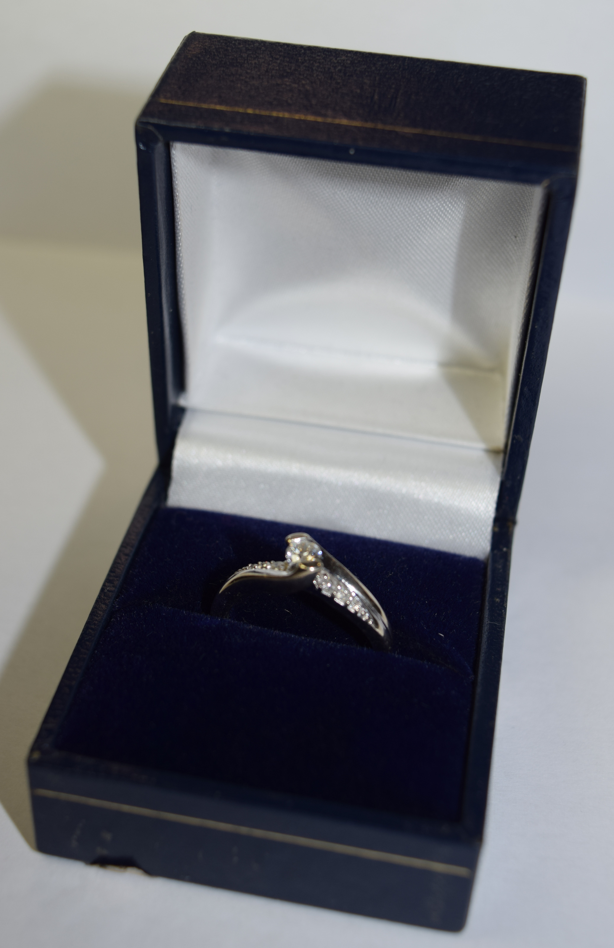 9ct gold Diamond Solitaire crossover ring with diamonds in shoulders