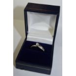 9ct gold Diamond Solitaire crossover ring with diamonds in shoulders