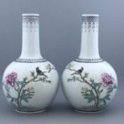 Pair of Jingdezhen mirror matched Chinese porcelain Famille Rose bottle vases