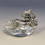 An attractive cut glass salt with hinged silver dragon lid.