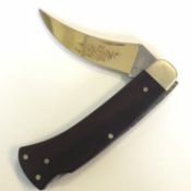 A rosewood handled hunting or fishing knife marked Solingen West Germany 89 FM