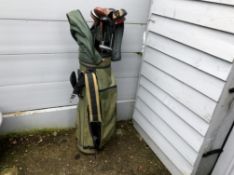 Green Memphis Golf Bag With a Quantity of Clubs Rain Hood Strap