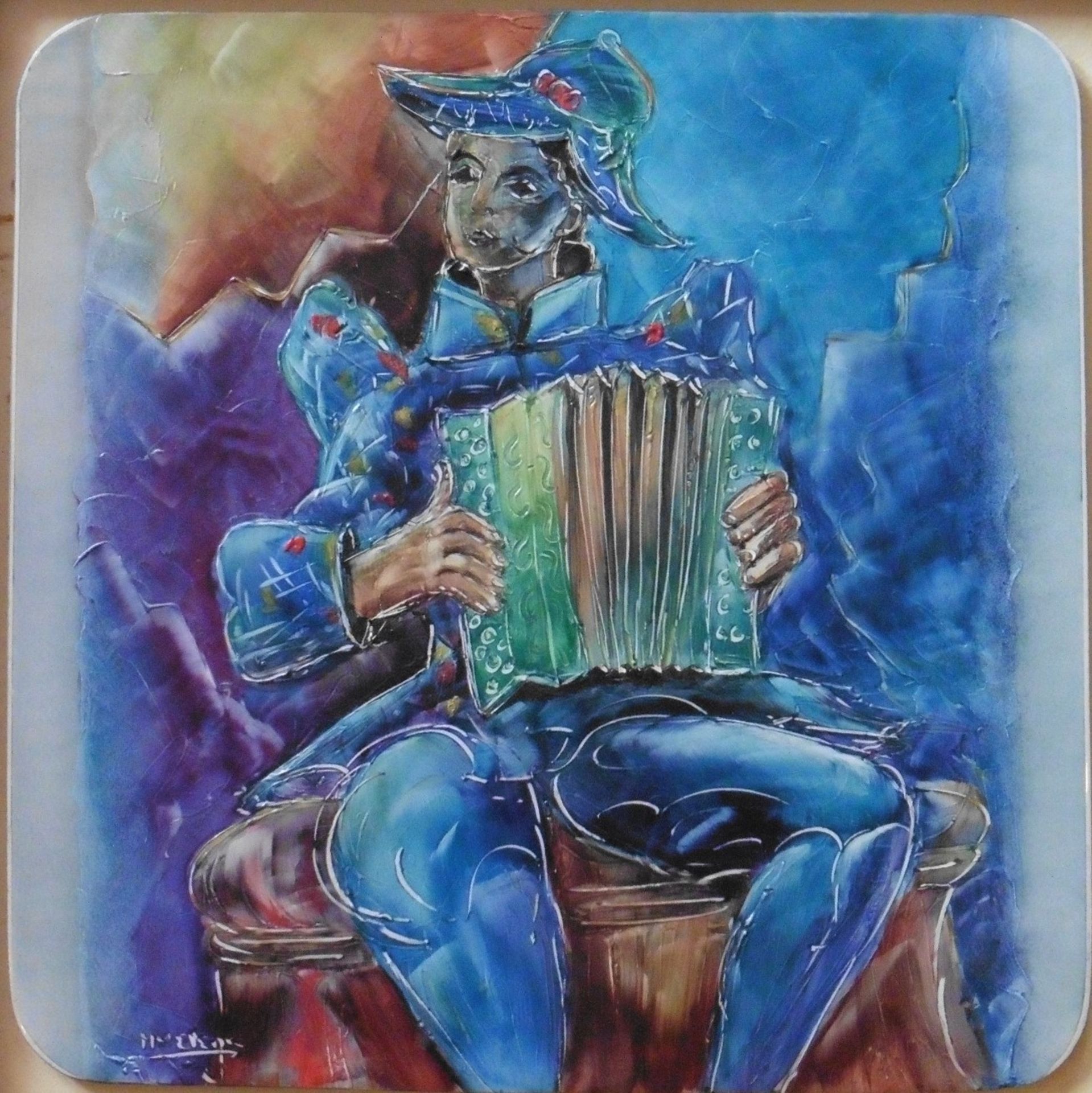 Framed painted ceramic tile “The accordion player” indistinctly signed within the tile