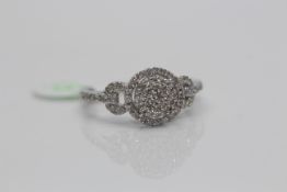 14ct White Gold Diamond Ring, set in a halo setting, with pave set diamonds