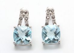 UNUSED - Certified by GIE 9ct White Gold Diamond And Blue Topaz Earring 0.05 Carats, Colour-D,
