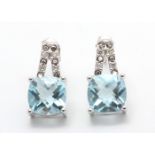 UNUSED - Certified by GIE 9ct White Gold Diamond And Blue Topaz Earring 0.05 Carats, Colour-D,