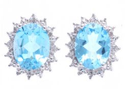 UNUSED - Certified by GIE 9ct White Gold Diamond And Blue Topaz Earring 0.03 Carats, Colour-D,