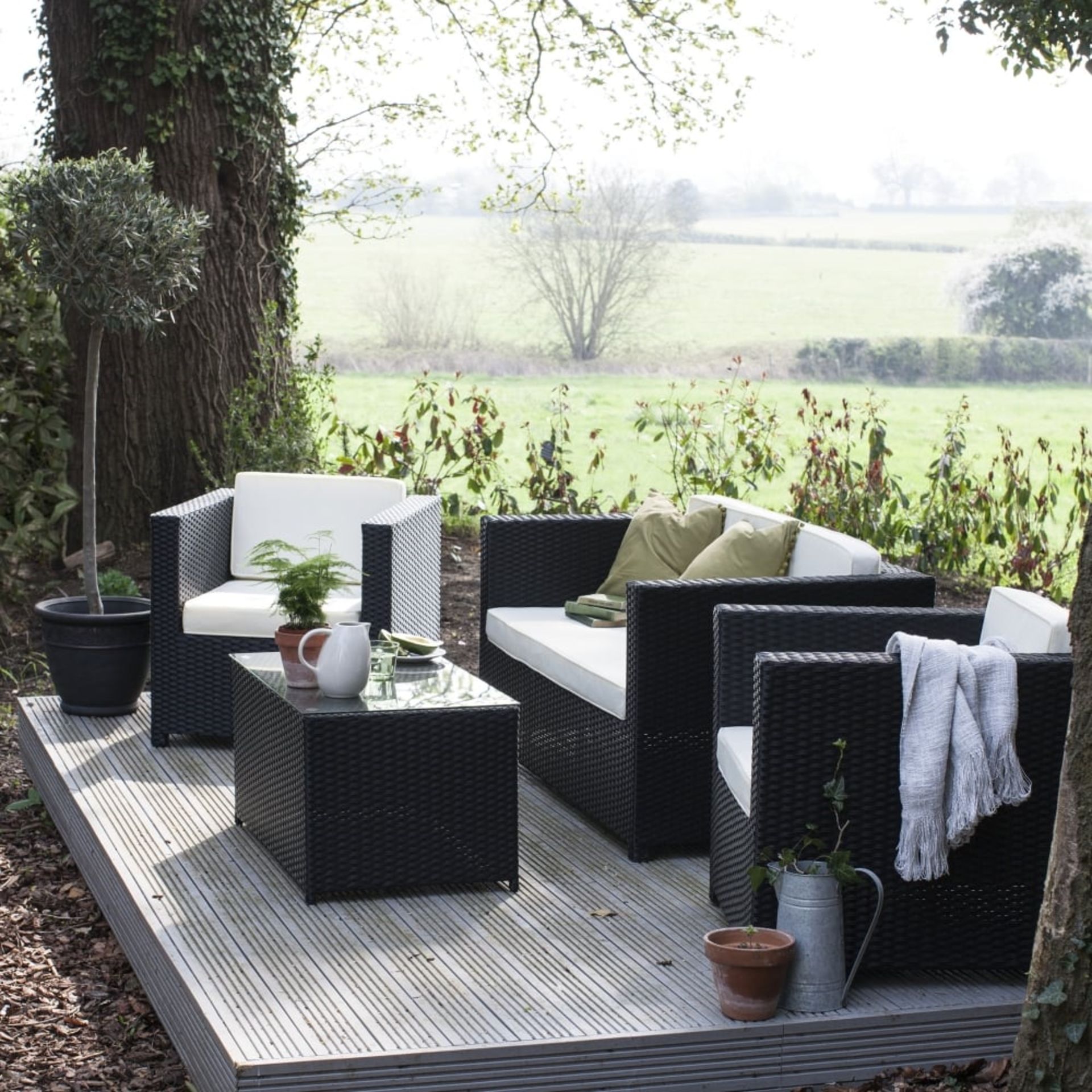 The Chelsea Black PU Rattan rattan garden sofa set.