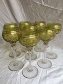 Set of eight gilt decorated hock glasses, 20the century, with gilt decorated lime green tinted bowls