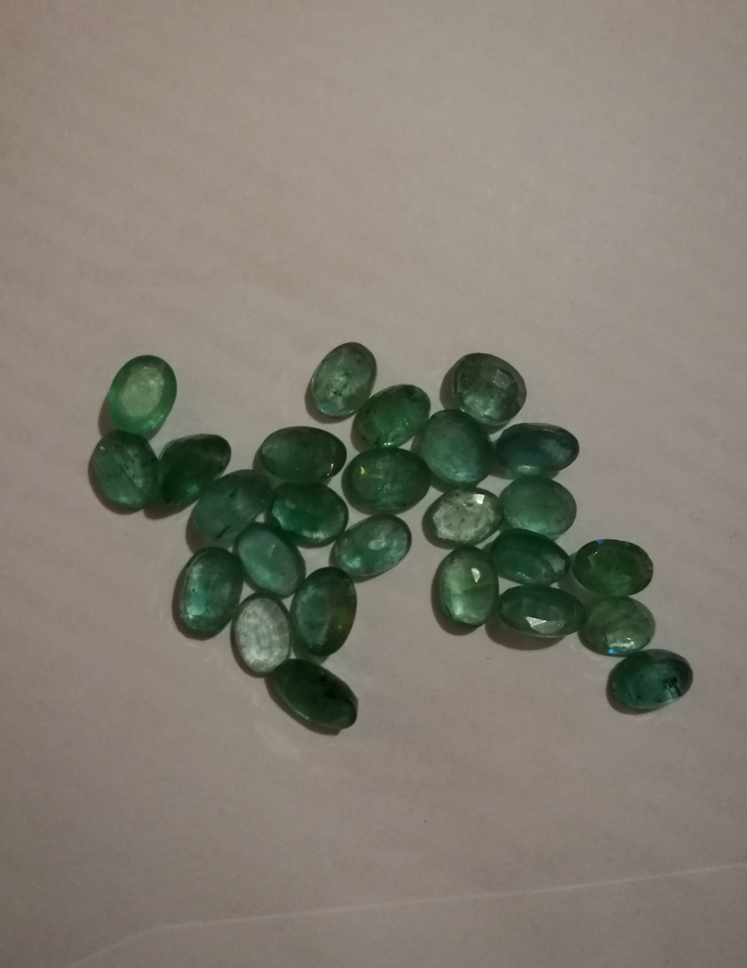 A Stunning Collection Of 26 Emeralds. Excellent Cut, Oval Shape In Medium Greens - Image 2 of 3