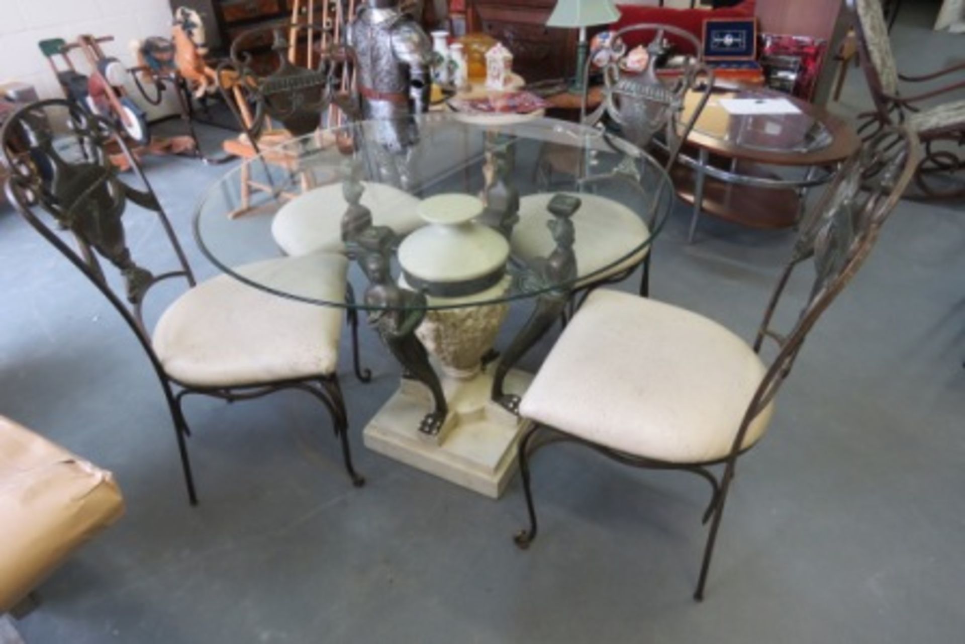 Ornate Cast Iron Framed Glass Top Table With Four Chairs