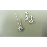 0.25ct / 0.50ct diamond pendant and earring set in platinum. Pendant - 0.25ct brilliant cut diamond,