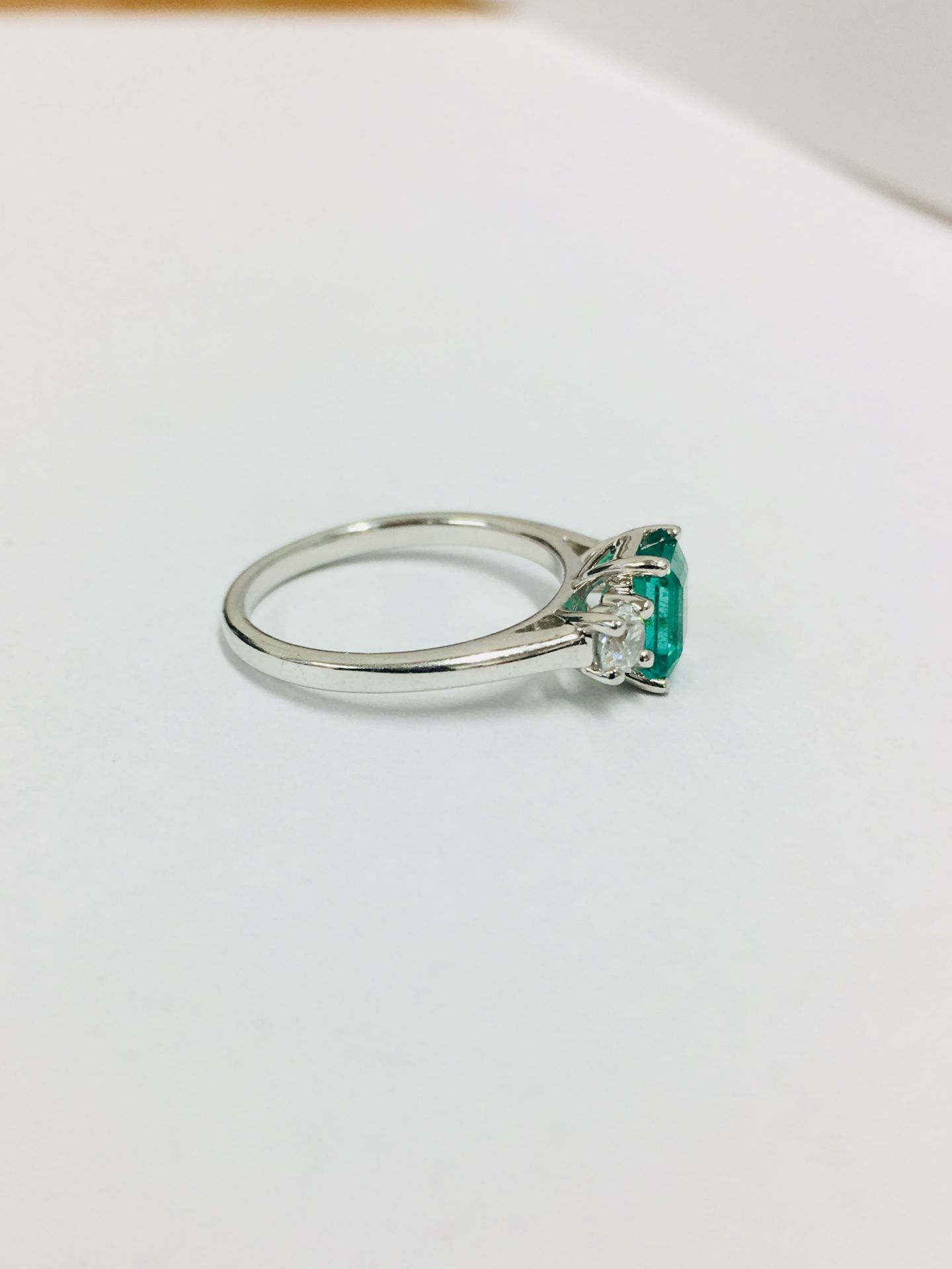 Emerald and diamond trilogy style ring. Rectangular cut emerald ( treated ) 0.70ct with a - Image 5 of 5