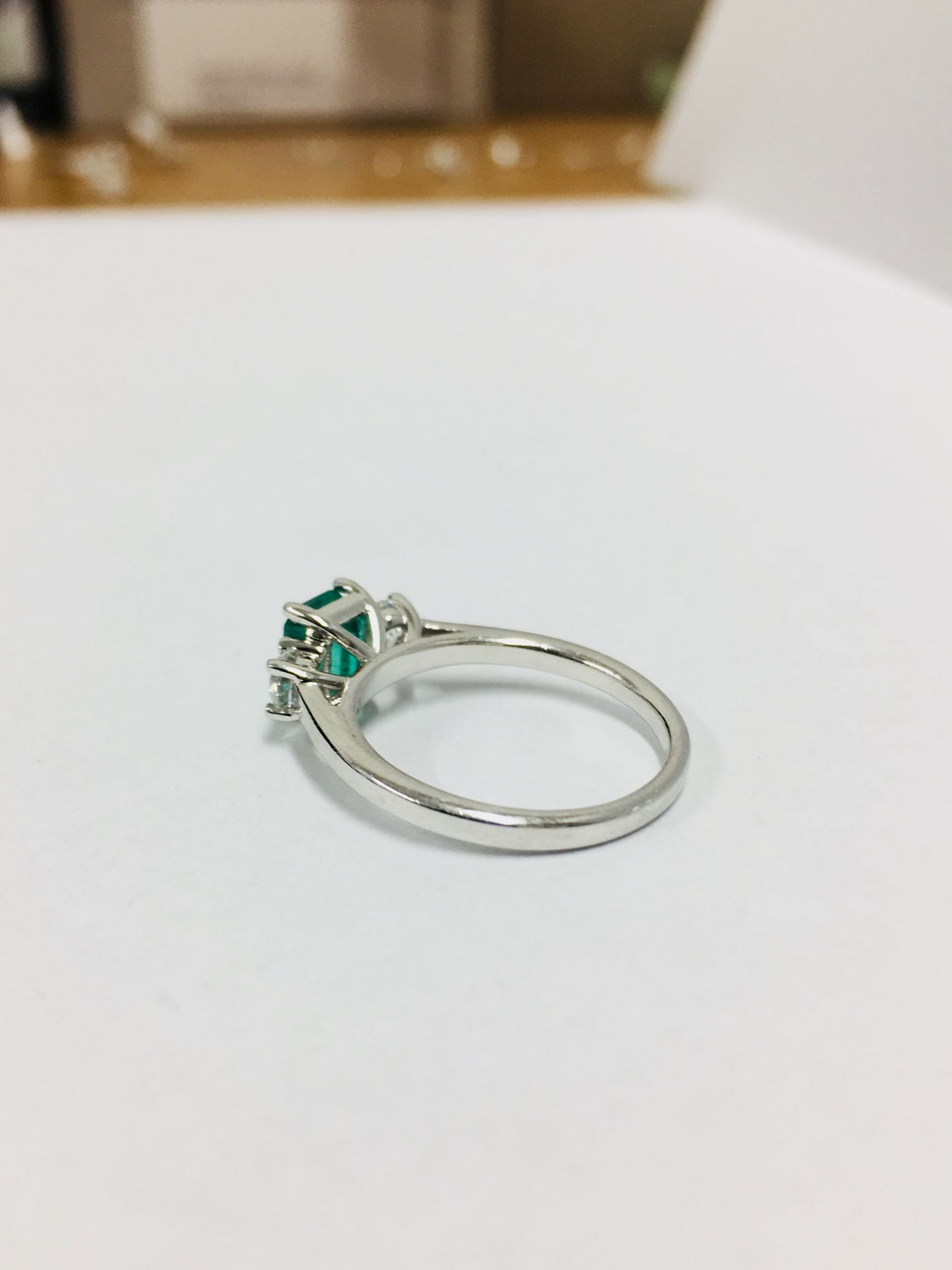 Emerald and diamond trilogy style ring. Rectangular cut emerald ( treated ) 0.70ct with a - Image 2 of 5