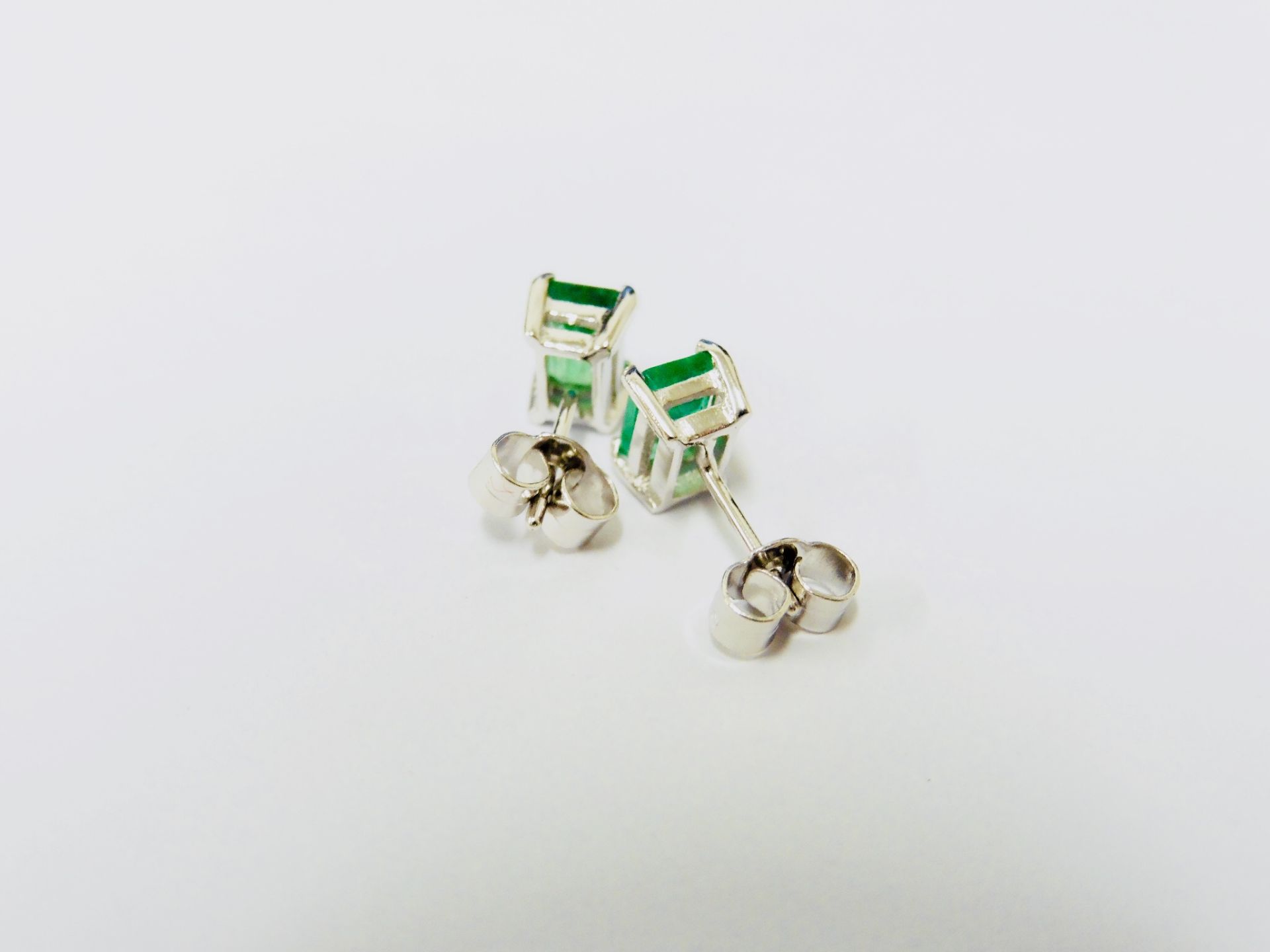 1.40ct stud earrings in platinum 950. 2 rectangular cut emeralds ( treated ) set in a simple 4 - Image 2 of 4