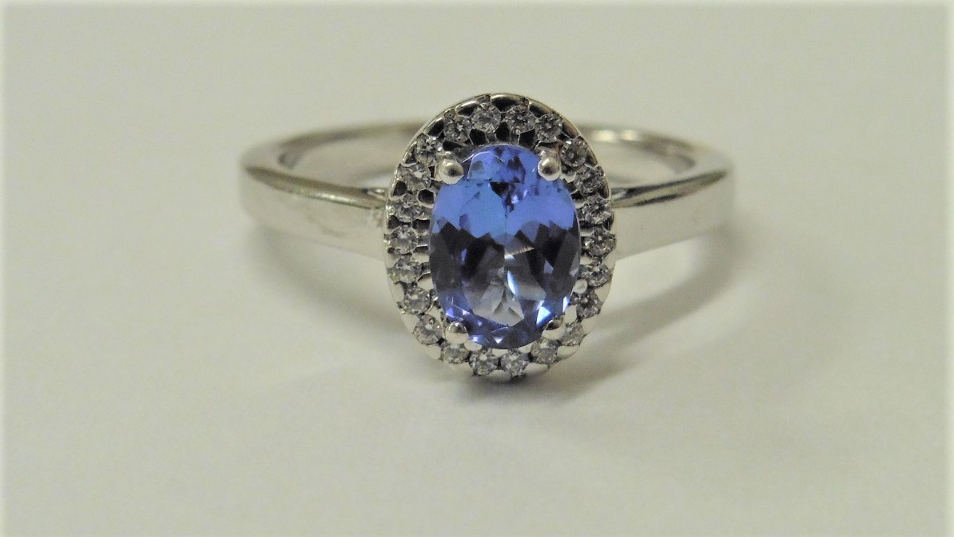 Tanzanite and Diamond cluster ring set in platinum. Oval cut tanzanite ( treated ) 1ct, surrounded - Image 2 of 3