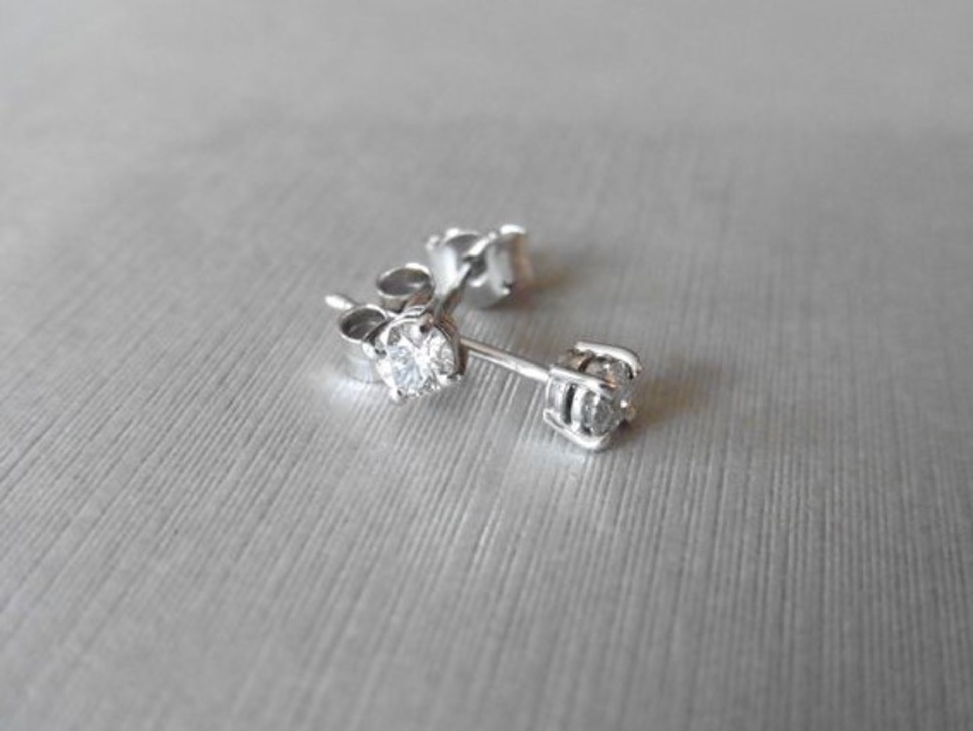 0.40ct diamond solitaire stud earrings set in platinum. I colour, si2-3 clarity.4 claw setting