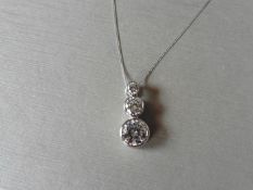 0.80ct trilogy diamond pendant set in platinum. 3 graduated brilliant cut diamonds, I/J colour,