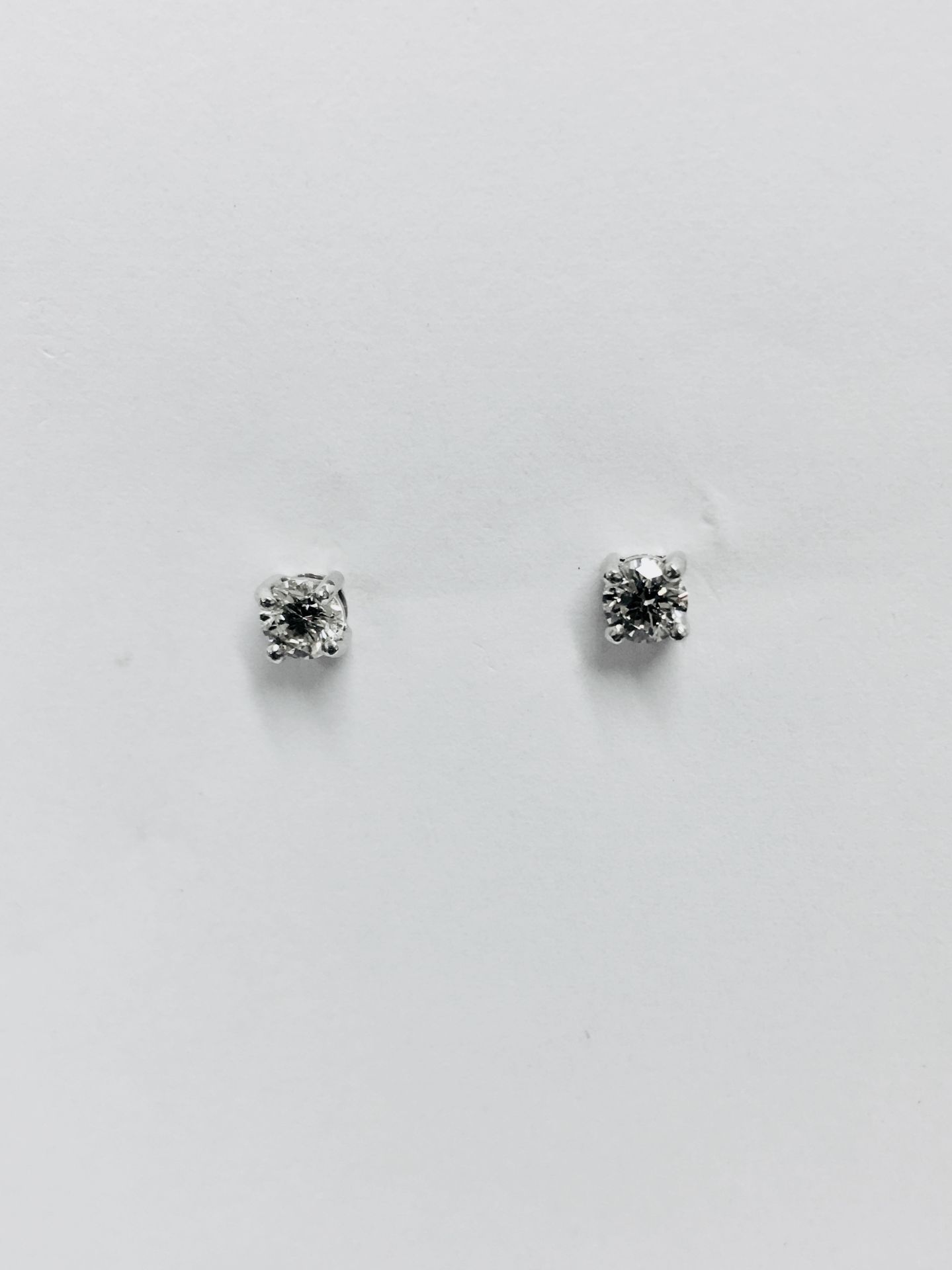 0.50ct diamond solitaire stud earrings set in platinum. I/J colour, si2 clarity.4 claw setting