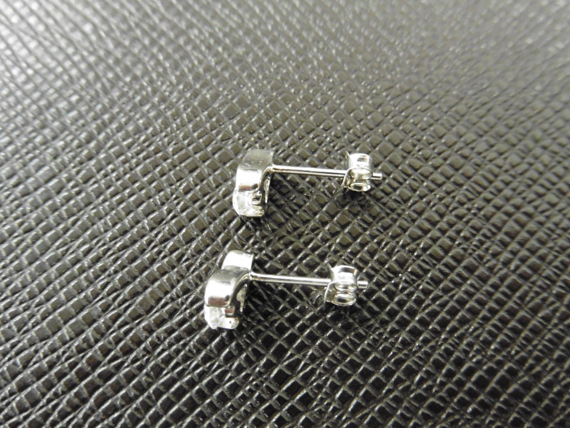 0.10ct diamond tear drop earrings set in platinum 950. 2 small brilliant cut diamonds, H colourand - Image 3 of 3