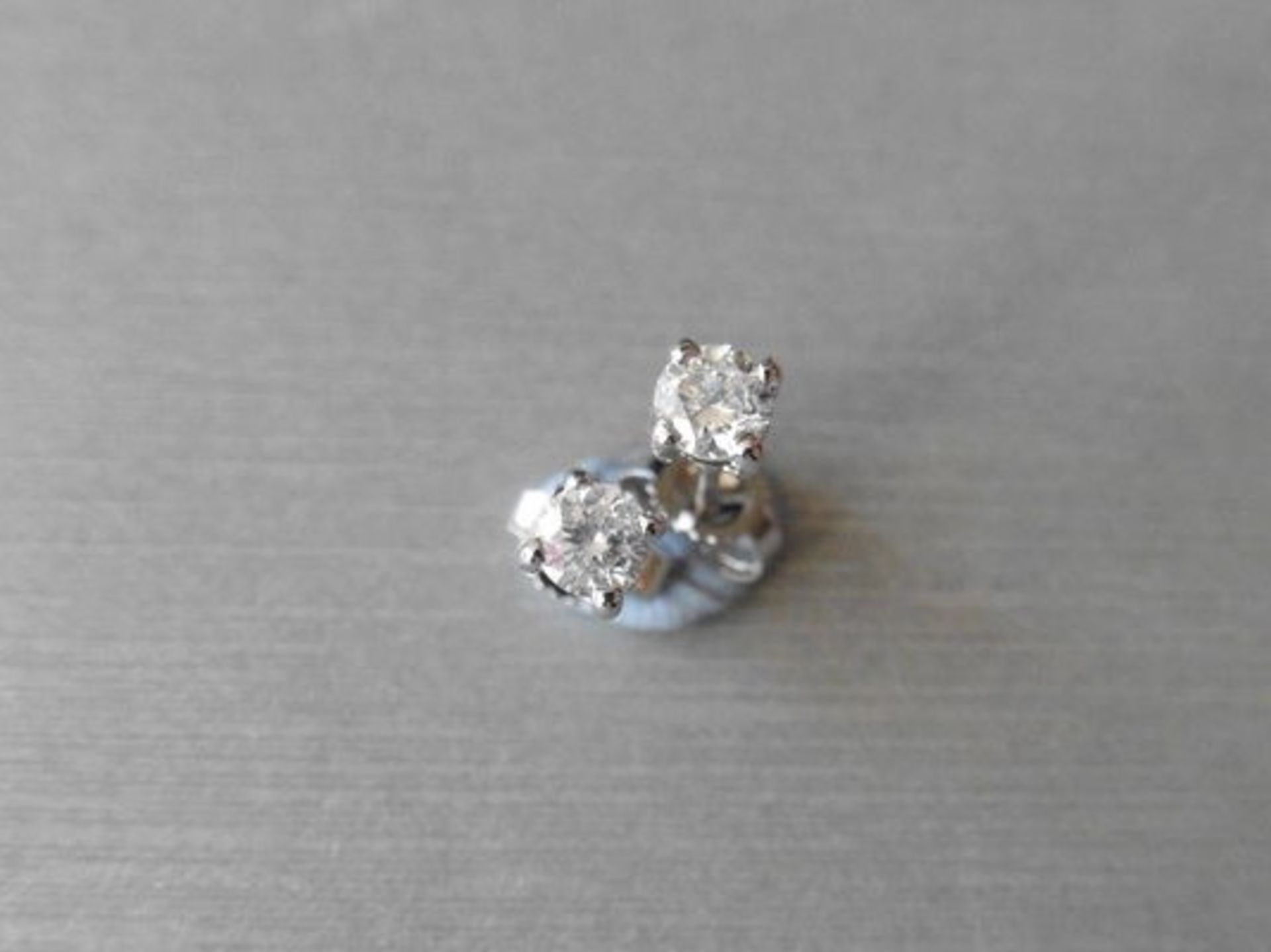 0.30ct diamond solitaire stud earrings set in platinum. I colour, si3 clarity. 4 claw setting with