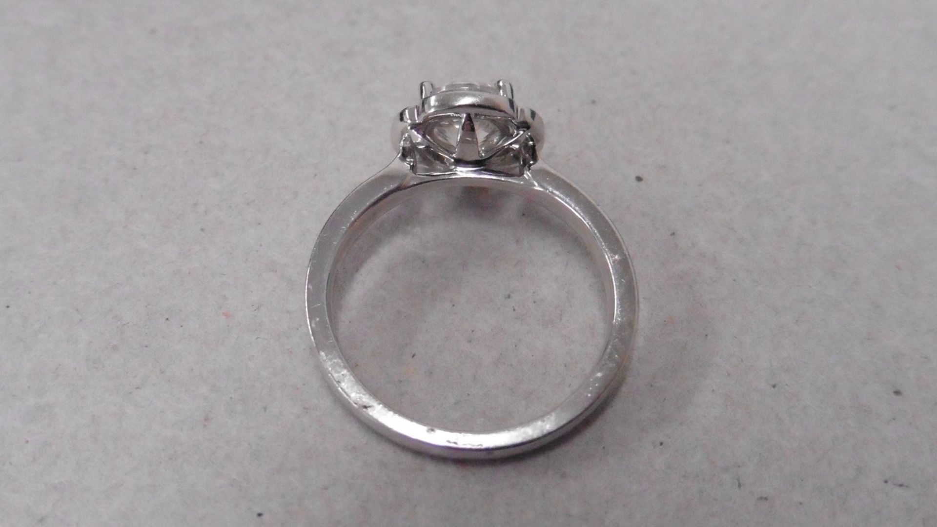 1.04ct diamond set soliatire ring in platinum. H colour and I1 clarity. Halo setting small - Image 2 of 3