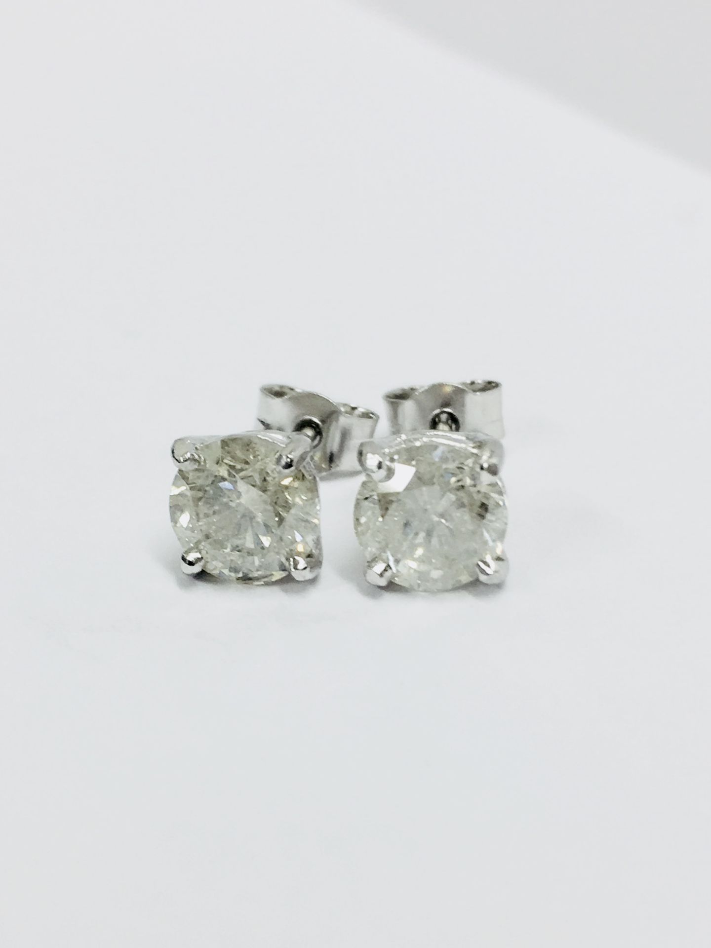 2.00ct Solitaire diamond stud earrings set with brilliant cut diamonds which have been enhanced. J