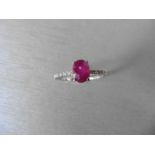 0.80ct / 0.12ct ruby and diamond dress ring. Oval cut ( glass filled) ruby with small diamonds set