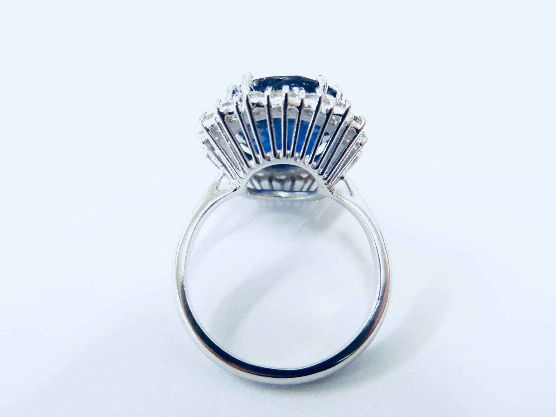 10ct sapphire and diamond cluster ring. Oval cut colour treated ( glass filled ) sapphire surrounded - Image 4 of 5
