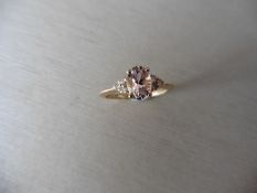 0.80ct / 0.09ct morganite and diamond dress ring. Oval cut morganite in the centre with 3 small